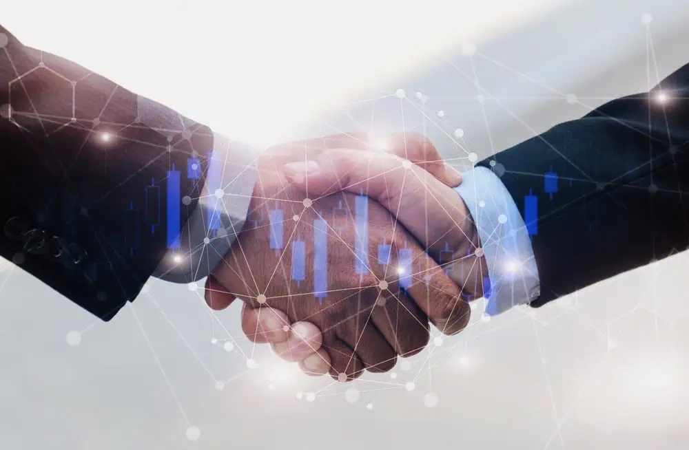 Two businessmen shaking hands to seal a corporate partnership