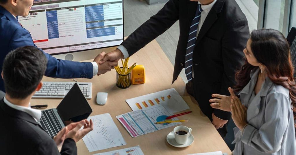 Business partners shaking hands