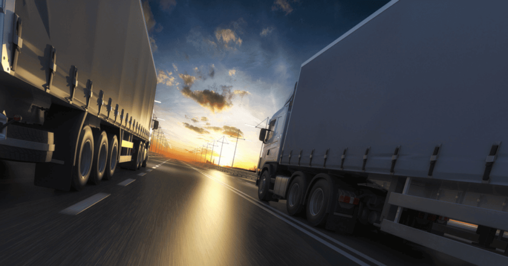 Trucking logistics and transportation fleet at sunset, emphasizing supply chain delivery solutions.