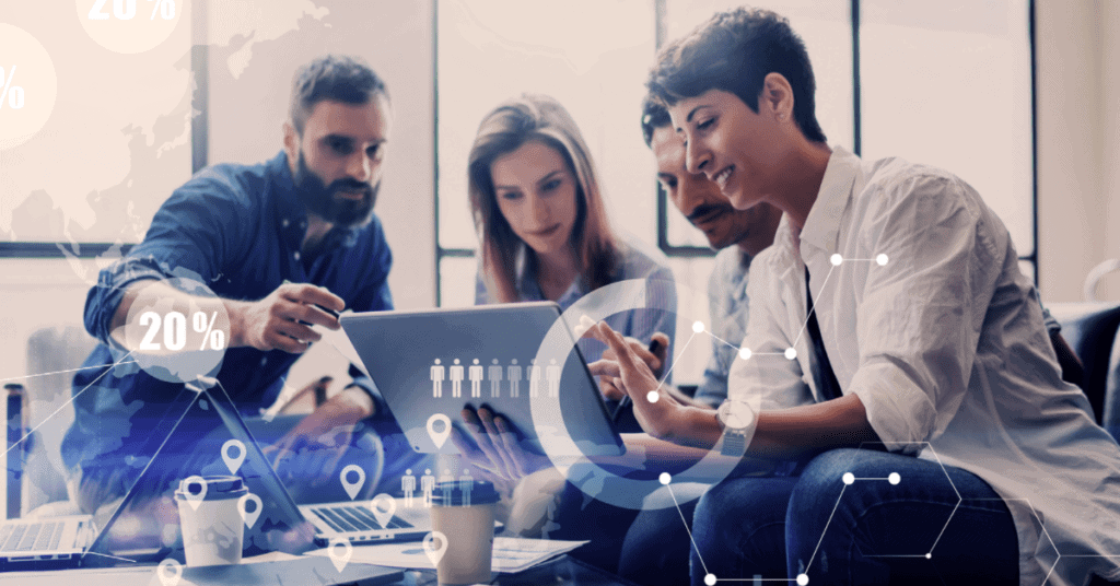 A team of shipping professionals reviewing digital analytics in an office