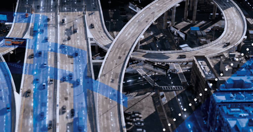 Aerial view of a bustling highway filled with OTR shipping trucks