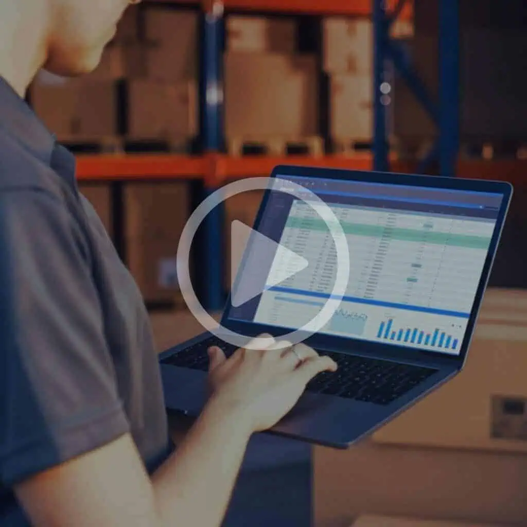Inventory management software on a laptop in a warehouse environment, showcasing Banyan Technology's logistics and supply chain solutions, order tracking, and real-time data analytics for efficient operations.