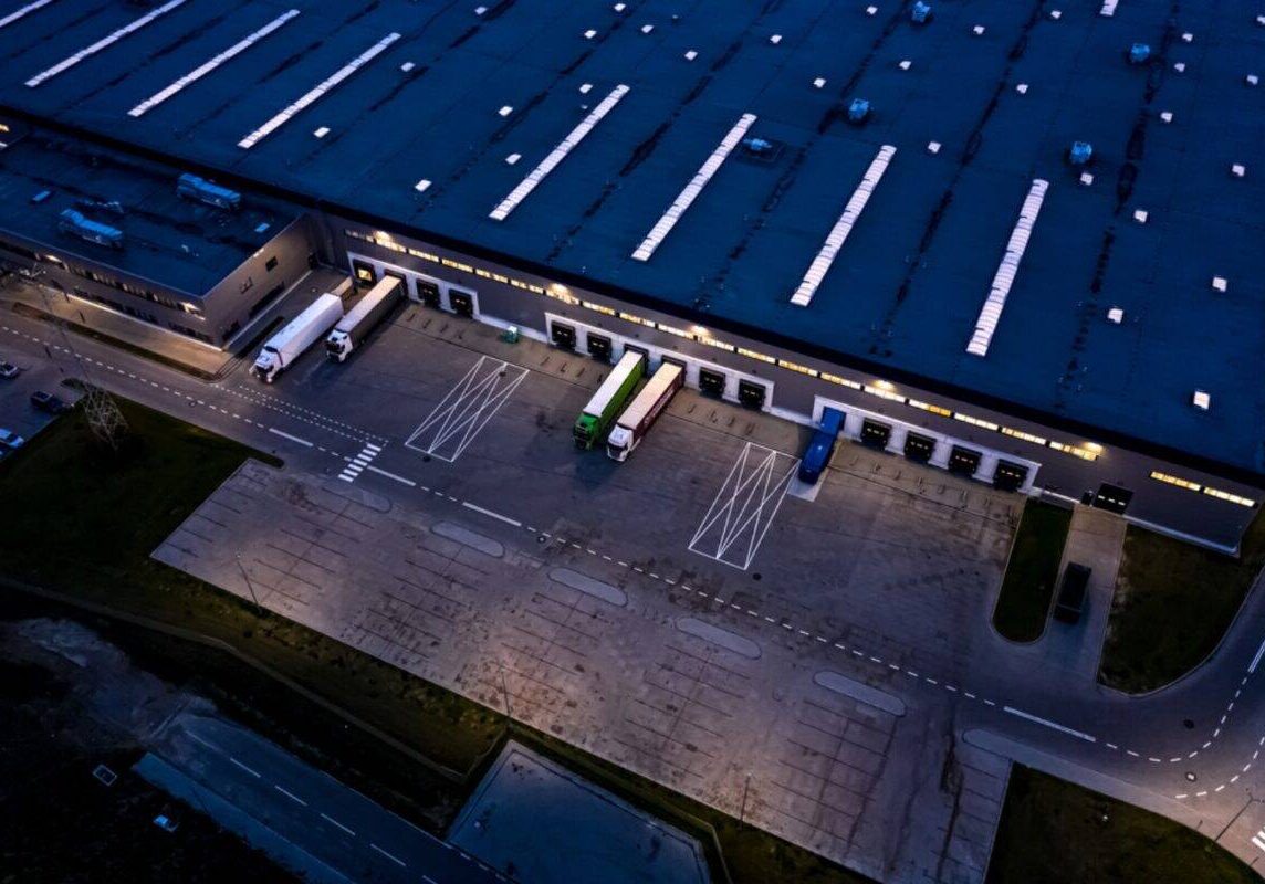 Freight trucks parked at a shipping facility